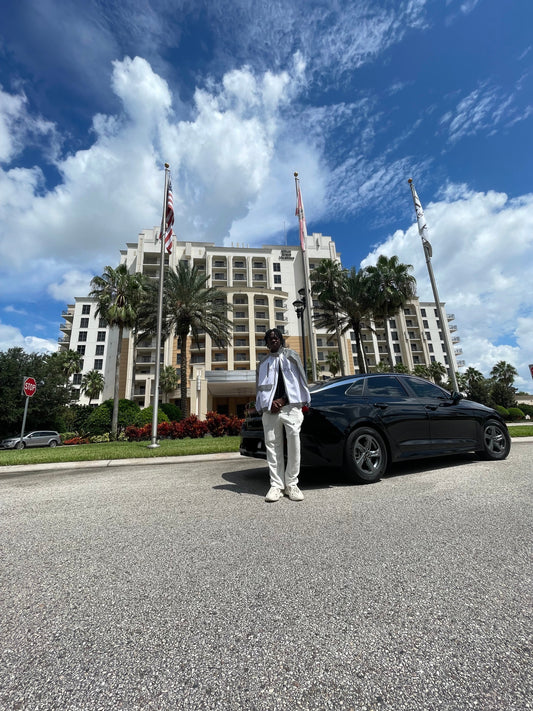 An elegant man showcasing a premium brand's stylish apparel in a contemporary setting.
